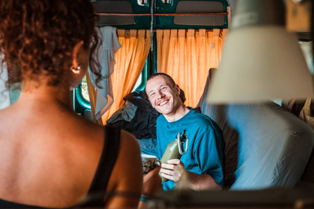 istock Couple camping in a van 1413040161