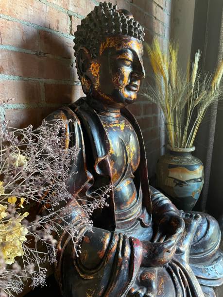istock Buddha statue in the dark interior 1413041852