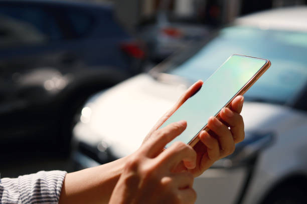 istock Using mobile app device on smartphone to unlock car doors 1413042042