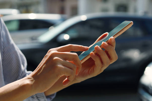 istock Using mobile app device on smartphone to unlock car doors 1413042046