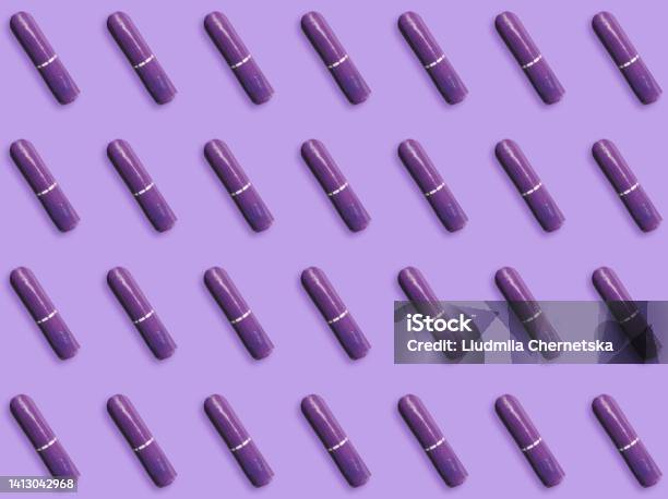 Many Tampons On Violet Background Flat Lay Stock Photo - Download Image Now - Alternative Medicine, Botany, Bush