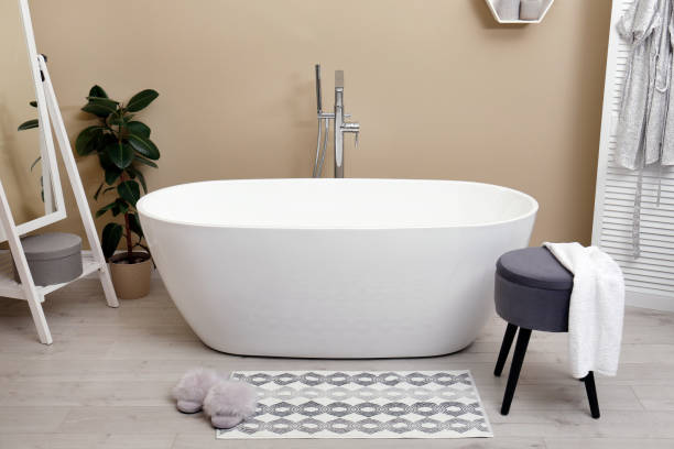 istock Cozy bathroom interior with stylish ceramic tub 1413043223