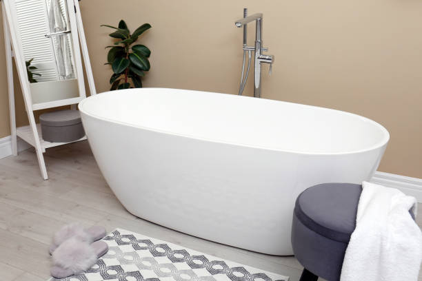 istock Cozy bathroom interior with stylish ceramic tub 1413043302