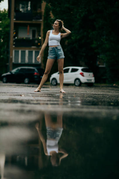 istock Young woman on steps in rain, 1413045431