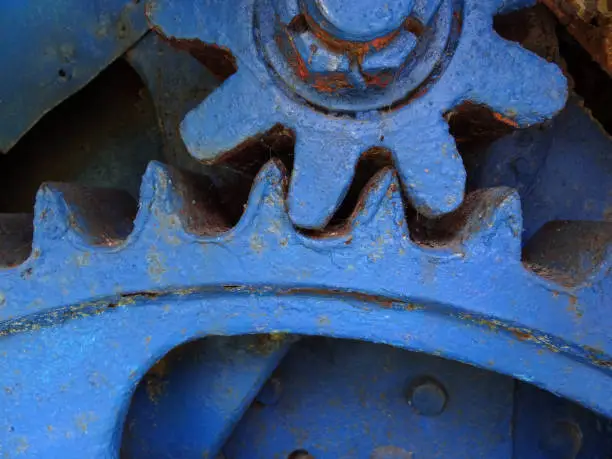 Blue metal  gear wheels close up mechanical concept
