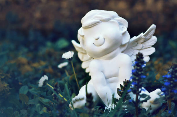 istock Angel sitting in the field 1413047086