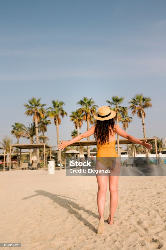 Shot of young woman on the beach Adult Stock Photo