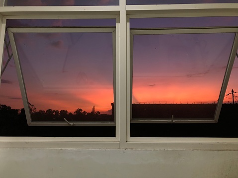 A view of mega red or red clouds in the afternoon from the window of the house