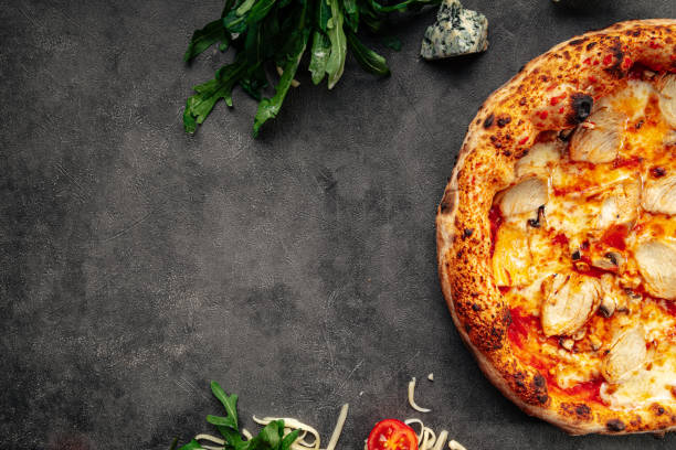 istock Fresh neopolitan chicken pizza on grey background 1413049925