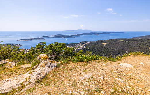 Beautiful view of croatian town viewed from mountain top on sunny day against blue sky