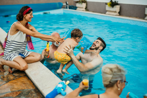 istock Multi generation family enjoying their pool time 1413050119