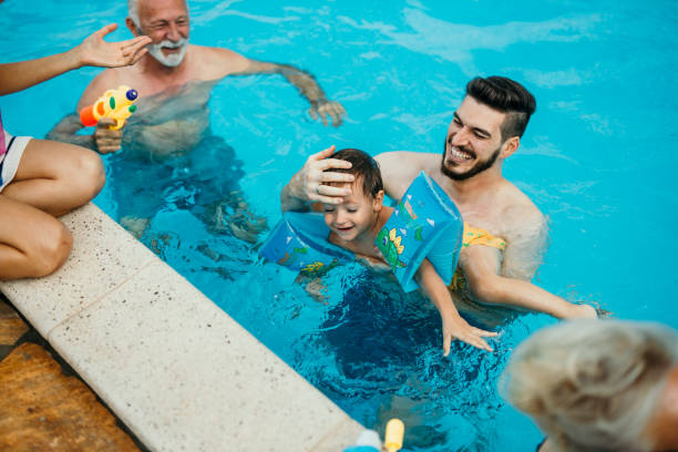 istock Multi generation family enjoying their pool time 1413050137