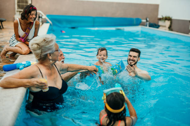 istock Multi generation family enjoying their pool time 1413050168