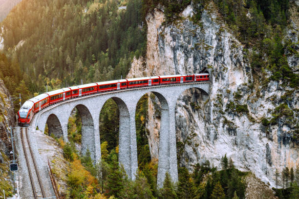 istock red Train crossing Landwasser Viaduct , Switzerland 1413051094