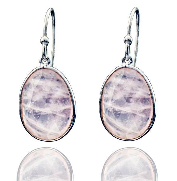 istock Golden earrings with gemstone isolated on white background 1413051175