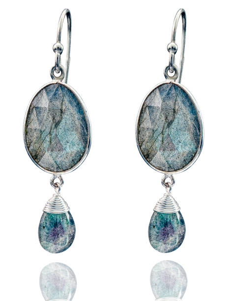 istock Golden earrings with gemstone isolated on white background 1413051201