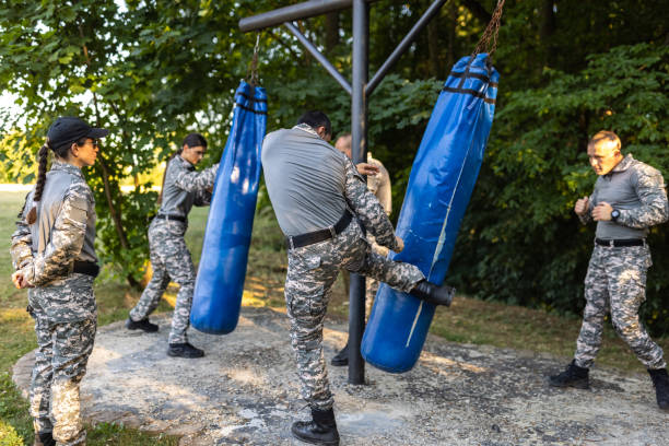 istock Military team, having an outdoor military training, leaded by female sergeant 1413052633