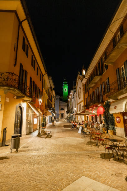 istock Illuminated streets amidst old buildings against clear sky during night 1413052747