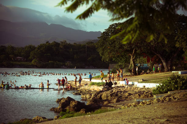 istock several people on a lush beach of vegetation 1413052861