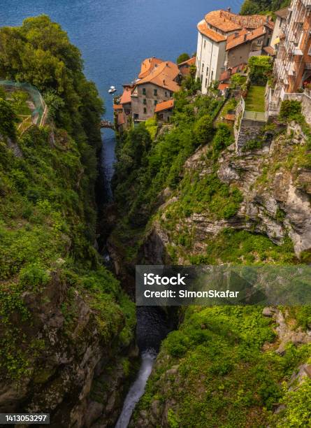 High Angle View Of Old Houses On Beautiful Mountains Against Lake Lake Como Italy Town Of Nesso Historic Stone Bridge Stock Photo - Download Image Now