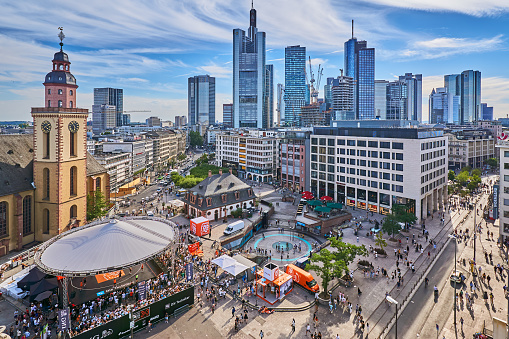 Frankfurt am Main, Germany - July 30, 2022: Party at the Konstablerwache in the city center of Frankfurt. In the background the skyscrapers of the banking district.