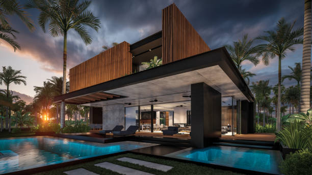 rendering 3d nowoczesnego domu z fasadą z drewnianej deski nad morzem lub oceanem o zachodzie słońca - luxury home zdjęcia i obrazy z banku zdjęć