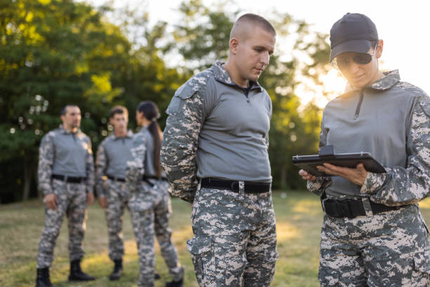 istock Female and male sargeant organizing the military training while using digital tablet 1413054654