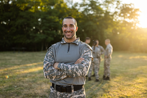 Portrait of Caucasian female and male military team, ready for the outdoor military training