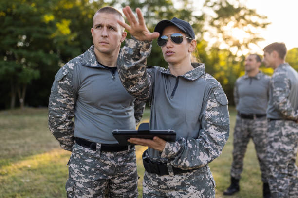 istock Female and male sargeant organizing the military training while using digital tablet 1413054822