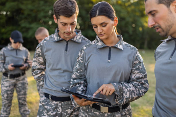 istock Female and male sargeant organizing the military training while using digital tablet 1413054921