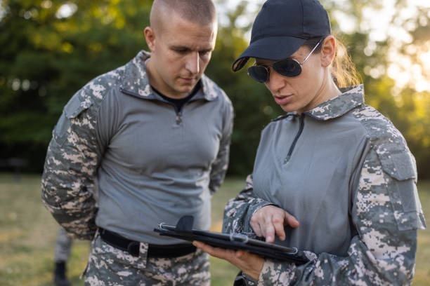 istock Female and male sargeant organizing the military training while using digital tablet 1413056326