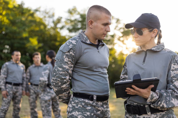 istock Female and male sargeant organizing the military training while using digital tablet 1413056328