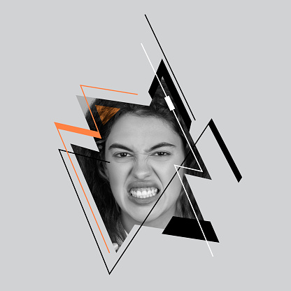 Angry. Young girl's face over gray background. Poster graphics. Ideas, inspiration, fashion. Different emotions, facial expression, psychology of personality concept. Monochrome, minimalism