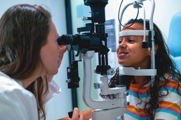 istock Little girl at the ophtalmologist. 1413059183