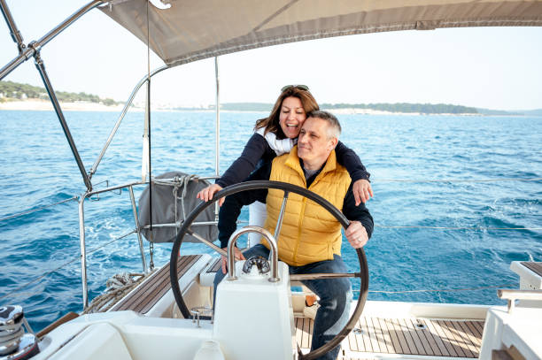 istock Couple on a sailboat 1413060726