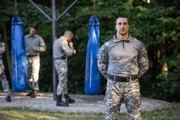 istock Portrait of male sargeant, while his team having an military training 1413061861