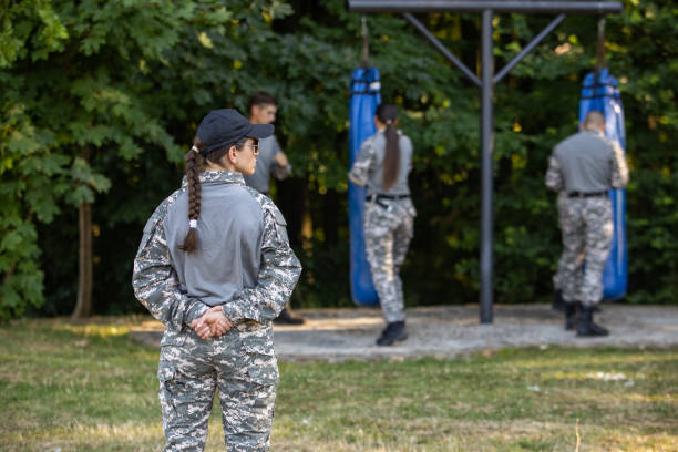 istock Military team, having an outdoor military training, leaded by female sergeant 1413061862