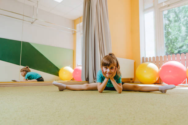 istock Little girl sitting on the twine looking at camera 1413061903
