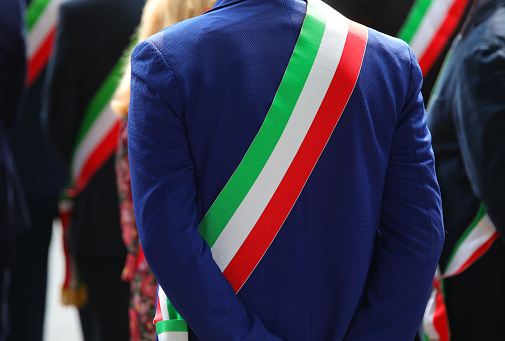 tricolor sash of the mayor dressed elegantly during a demonstration with many mayors in Italy