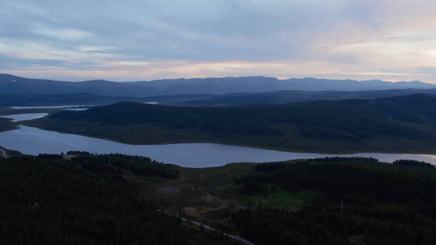 istock Aerial view on lakes and mountains with dramatic sky in Altai 1413062366