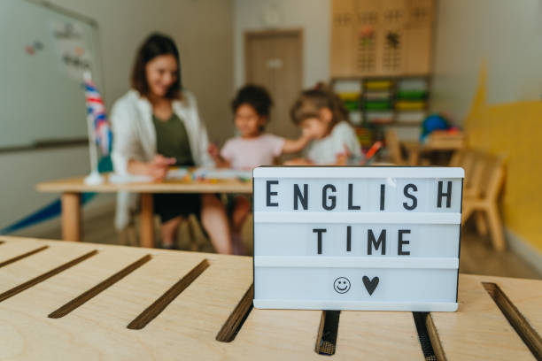 English lesson at elementary school or kindergarten Inscription English time in the classroom. Selective focus on the words. English language lesson at elementary school or kindergarten. english culture stock pictures, royalty-free photos & images