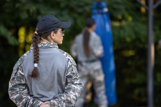 istock Military team, having an outdoor military training, leaded by female sergeant 1413062559