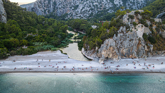 Aerial view of Olympos-Antalya, ancient city of olympos, olympos beach, people swimming on the beach, olympos castle, aerial view of the ancient city