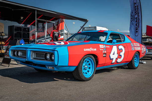 Customized 1971 Dodge Charger Hardtop Coupe Lebanon, TN - May 13, 2022: Wide angle low perspective  front corner view of a customized 1971 Dodge Charger Hardtop Coupe at a local car show. dodge charger stock pictures, royalty-free photos & images