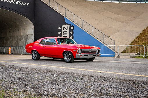Lebanon, TN - May 14, 2022: Wide angle front corner view of a 1971 Chevrolet Nova SS Coupe driving on a road.