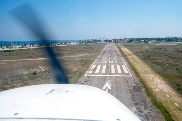 istock Light aircraft landing about to land. 1413066072