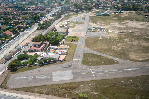 Aerial view of an airport terminal with turbo prop aircraft.