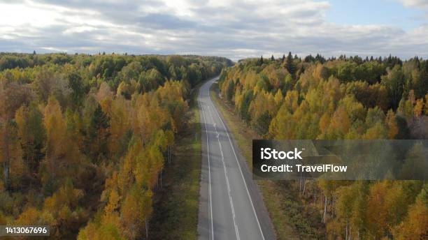 Asphalt Road With Traffic Cars Between Forest In Ural Stock Photo - Download Image Now
