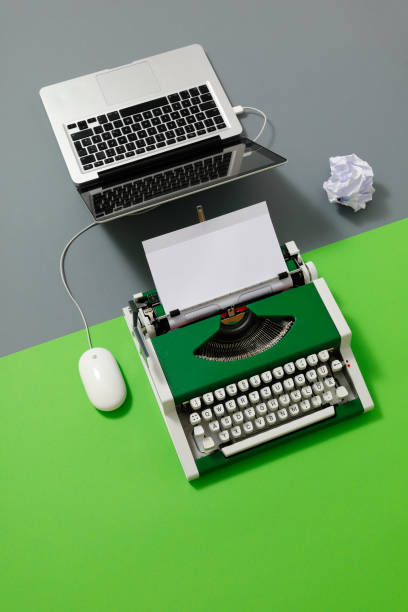 istock Digital und analog – Laptop and 70s Typewriter 1413067883