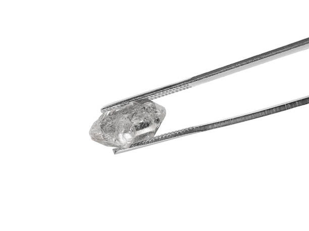 istock natural diamond on white background held in diamond tweezers 1413067950